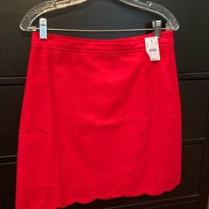 J.Crew red skirt with scalloped hem. New with tags, never been worn.